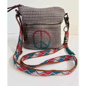 The Sak crochet peace messenger bag